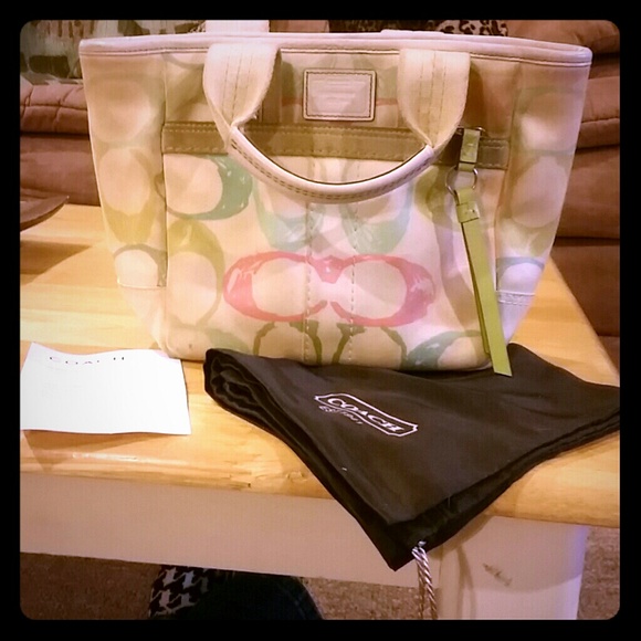 Multi colored Coach signature collection hand bag