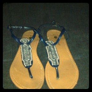 Navy blue thong sandals w/ silver tone studs.