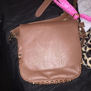 Cross body purse w/ gold studs .