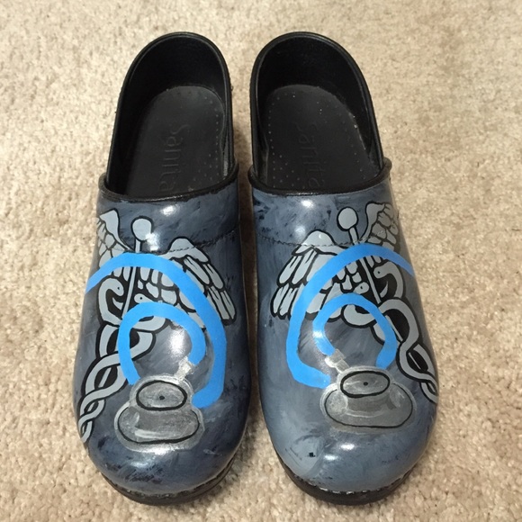 Sanita clogs.