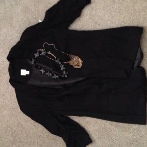 Bundle of necklaces and blazer