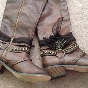 Tall dark brown buckle boots