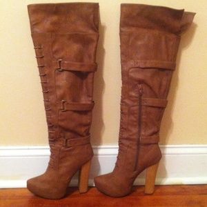 Leather knee high platform boots.