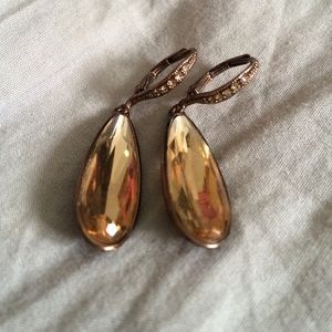 Gold earrings with large rhinestone