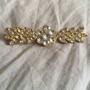Gold and rhinestone pin