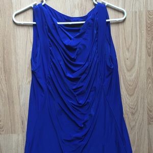 The limited blue sleeveless blouse