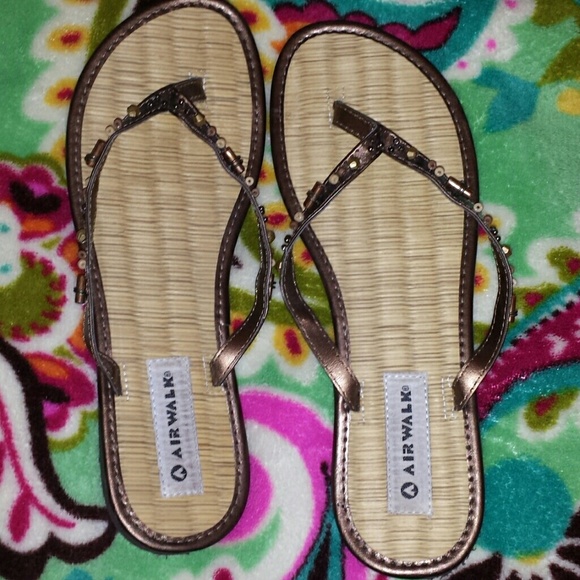 Brown beaded flip flops
