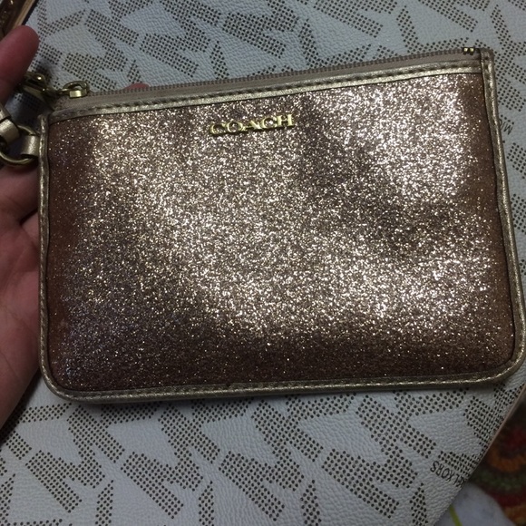 SOLD ON MERCARÍ Gold sparkle Coach wristlet!