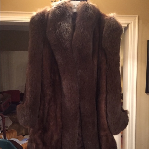 Brown mink with fox trim coat. Henig furriers.