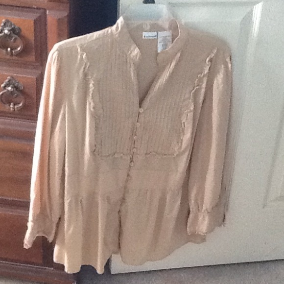 Tan colored shirt. Super cute