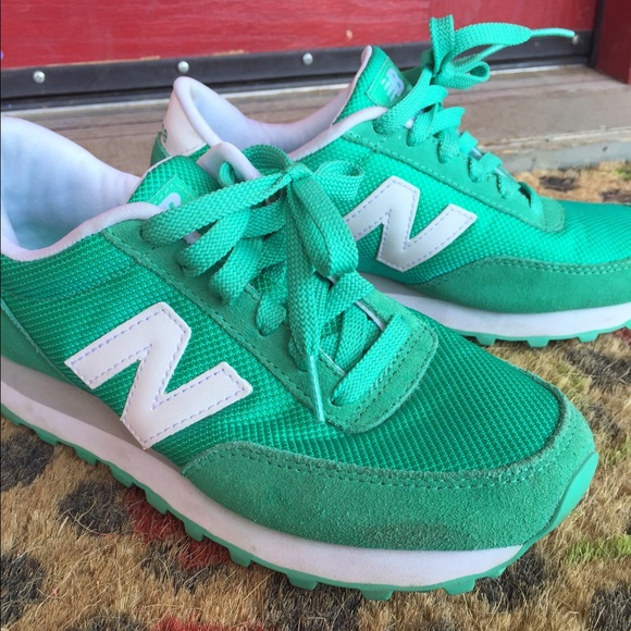 Teal green New Balance shoes