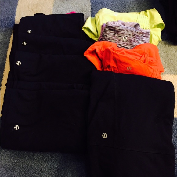 Lot of Lululemon tanks , zipup and capris/pants