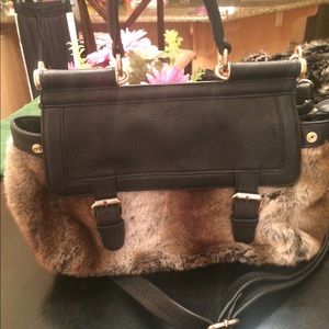 Black purse with faux fur