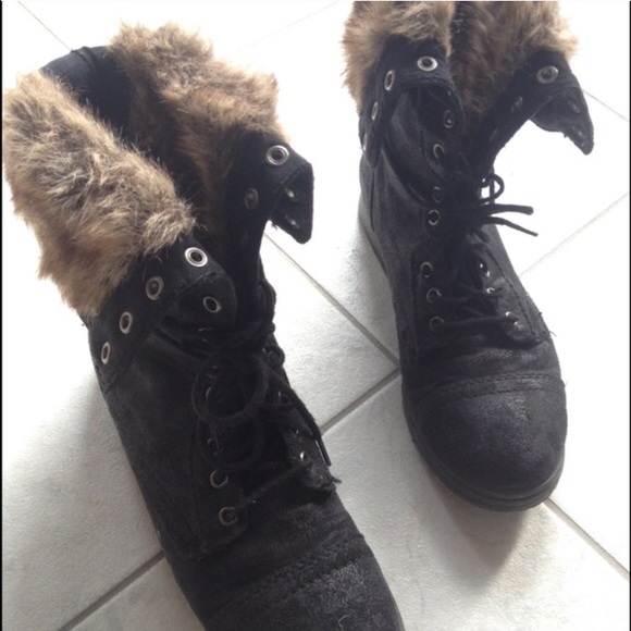 Black suede combat boots.