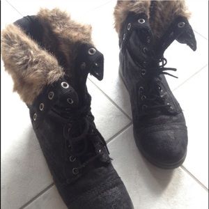 Black suede combat boots.