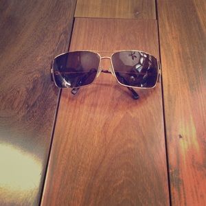 Prada Gold Rimmed Sunglasses