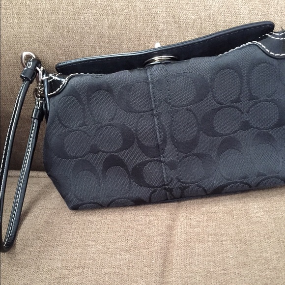 Black COACH turn key medium wristlet!