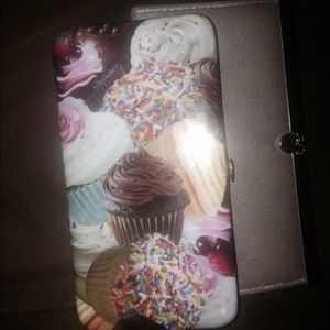 2 wallets. One cupcake wallet and one glitter
