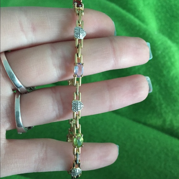 Mulit colored stone bracelet styled in gold.