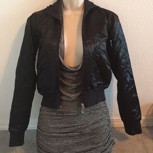 Bebe bomber jacket with zipper detail. Satin.