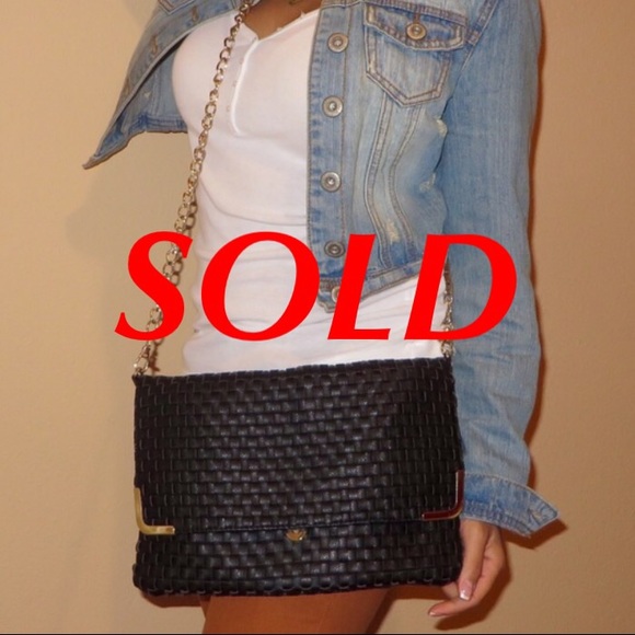 Black woven fold-over cross body bag