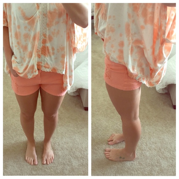 Peachy-orange summery shorts with ripped detail