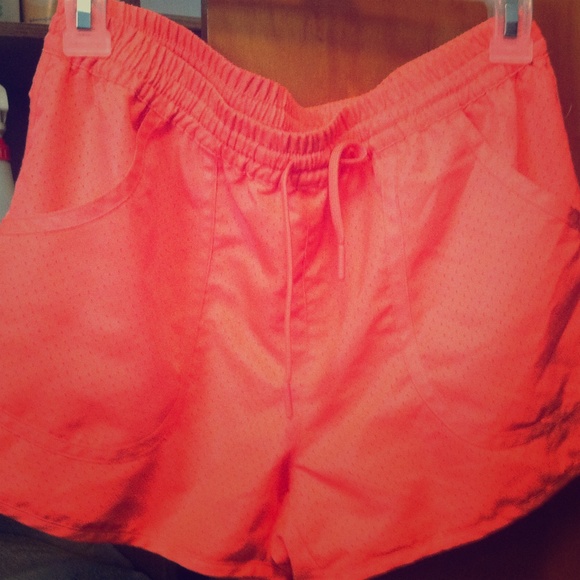 Never worn, highlighter coral running shorts