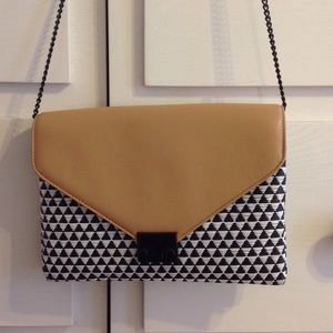 Loeffler Randall leather and woven lock clutch