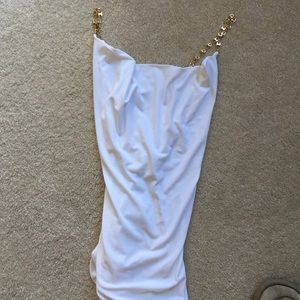 White fitted top with gold metal straps