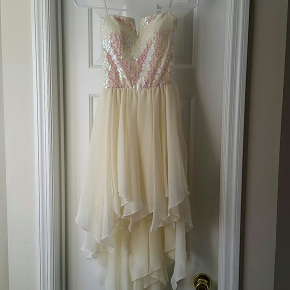 White high-low strapless dress.