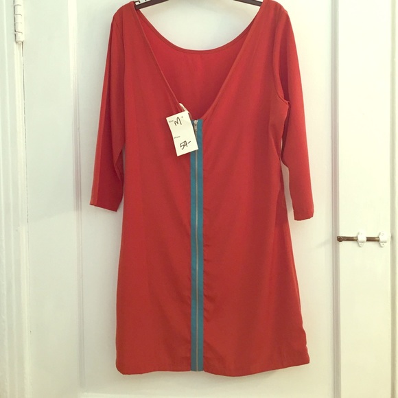 Orange tunic with turquoise zipper.