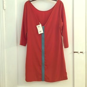 Orange tunic with turquoise zipper.