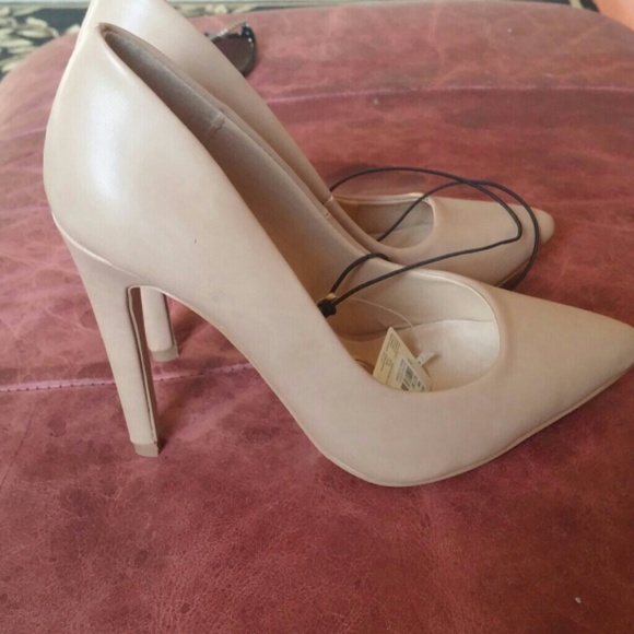 Nude pointy heels.