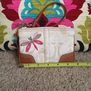 COACH wristlet with embroiled dragonfly
