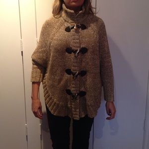 Cape sweater with toggles