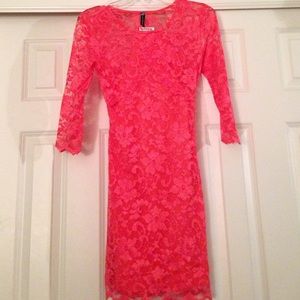 Short, form-fitted, deep cutout dress