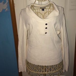 Cream woman's sweater.