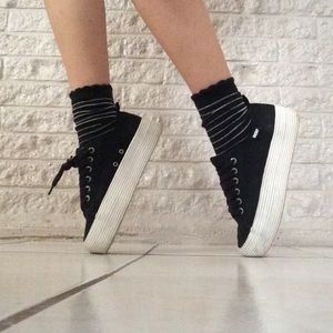 Black platform sneakers.