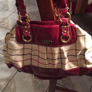 Used Coach purse, handles has wear, inside is ok.
