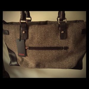 Gorgeous NWT never used Tumi bag!