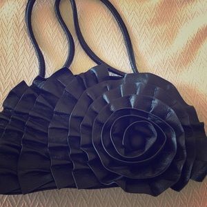 Black purse with unique floral design