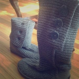 Knit gray Ugg Boots with three button details.