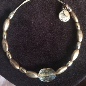 Beaded Alex and Ani gold bracelet.