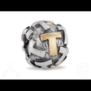 Gold plated T Pandora charm.