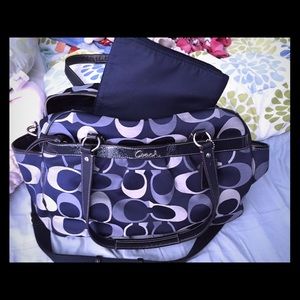 Navy blue Coach diaper bag with changing mat