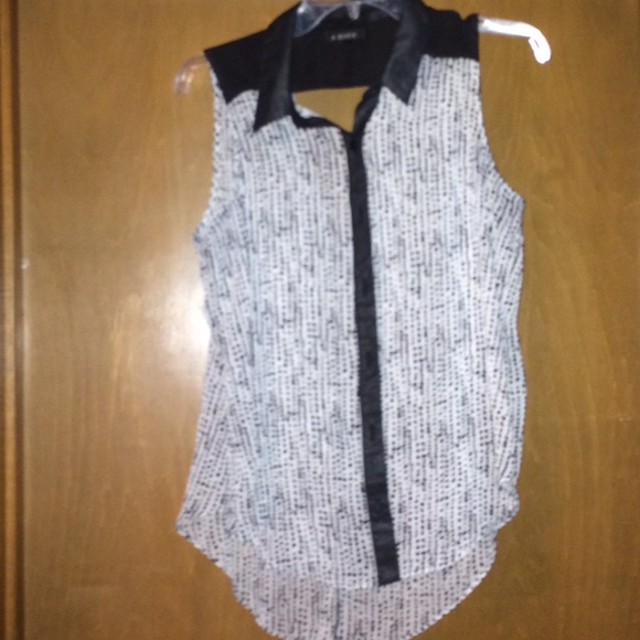 Sleeveless peak-a-boo shirt...  Size Large...