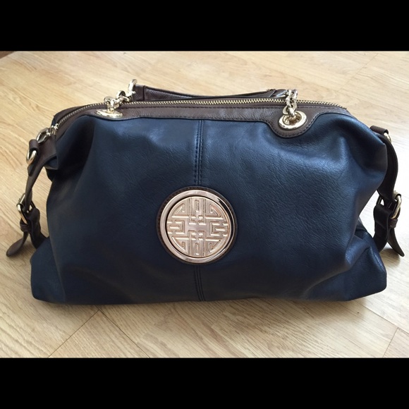 Dark blue / brown strap bag