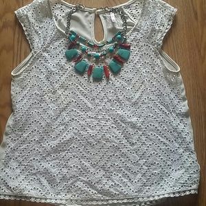 White top with cut outs.