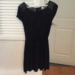 Short black short sleeved dress with sheer details