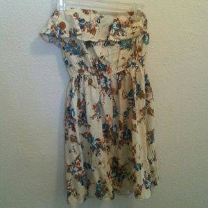 Short, cream colored, floral dress.
